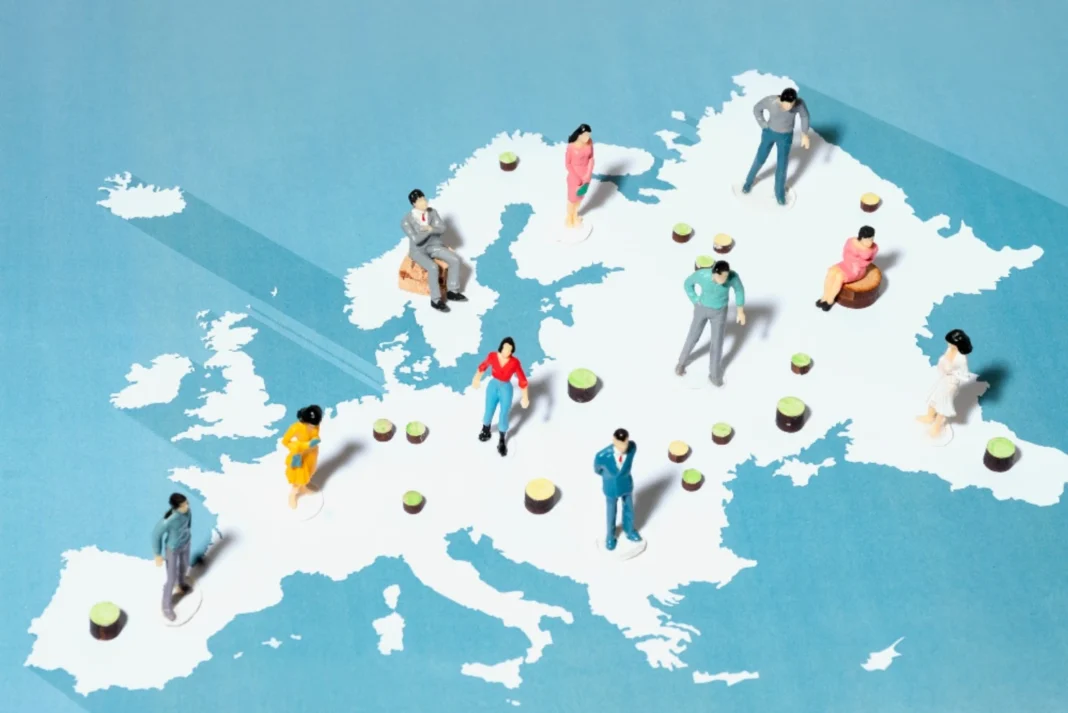 Map of Europe with miniature people positioned across different European countries